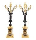 A Pair of Figural Painted and Parcel Gilt FiveLight Torchieres