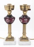 A Pair of Cranberry Glass Lamps