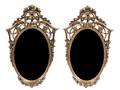 A Pair of Oval Giltwood Mirrors