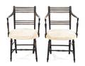 A Pair of Regency Ebonized Open Armchairs