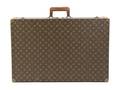 A Louis Vuitton Monogram Canvas Hardsided Suitcase