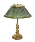 A Tiffany Studios Gilt Bronze and Favrile Glass Linen Fold Lamp