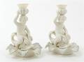 A Pair of Belleek Figural Candlestick