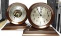 A Bronze Chelsea Ships Clock and Barometer Set