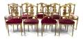 A Set of Nine Neoclassical Giltwood Side Chairs