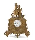 A French Gilt Bronze Figural Mantel Clock