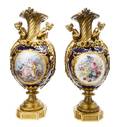 A Pair of Sevres Style Cobalt Painted Porcelain Gilt Bronze Mounted Vases