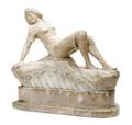 A Carved Alabaster Figure of a Reclining Woman