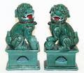 A Pair of Glazed Porcelain Fu Dogs