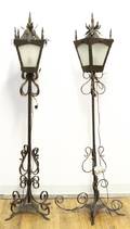 A Pair of Cast Metal Gothic Style Floor Lamps