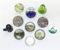 A Group of Eleven Glass Paperweights
