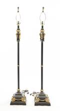 A Pair of Ebonized and Gilt Metal Floor Lamps