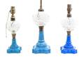 A Collection of Three Blue and Clear Glass Lamps