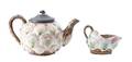A Majolica Teapot and Creamer in Shell Motif