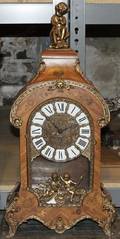 A Louis XV Style Marquetry and Gilt Metal Mounted Mantel Clock