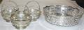 An English Silver Bowl and Three Matching Small Baskets London 1985