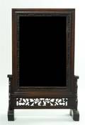 A Chinese Wood Framed Mirror