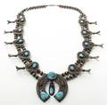 A Navajo Squash Blossom Silver Coral and Turquoise Necklace