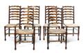 A Set of Twelve American Oak Ladderback Dining Chairs