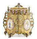 A Continental Renaissance Revival Gilt Bronze and Porcelain Jewelry Case