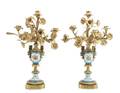A Pair of Louis XVI Sevres Style Gilt Metal and Porcelain FourLight Candelabra