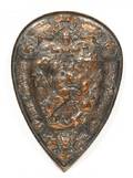 A Bronze Shield Form Plaque