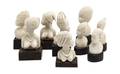 A Collection of Nine African Carved Ivory Busts of Females