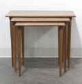 A Set of Three Norwegian Simulated Rosewood or Birch Nesting Tables