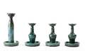 Four GreenGlazed Art Pottery Candlesticks
