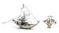 Two Diminutive Silvered Figures of Boats
