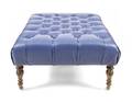 A Faux Leather Tufted Upholstered Ottoman