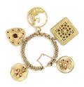 A Yellow Gold Charm Bracelet with Five Attached Charms