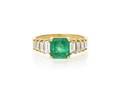 An 18 Karat Yellow Gold Emerald and Diamond Ring