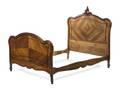 A Louis XV Style Walnut Bed