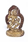 A Tibetan Gilt Bronze Figure