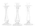 A Set of Three Glass Candlesticks