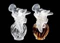 A Pair of Lalique Molded and Frosted Glass Perfume Bottles for Nina Ricci