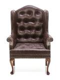 An English Style Tufted and Studded Leather Wing Back Armchair