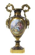 A Sevres Style Gilt Bronze Mounted Porcelain Urn