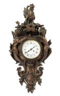 A French Bronzed Plaster Cartel Clock