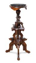 A Black Forest Carved Walnut Pedestal Table