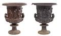 A Pair of Painted Iron Garden Urns