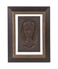 A Carved Wood Relief Portrait