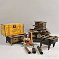 Four Miniature Stoves a Steam Engine and an Advertising Tin