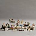 Twentyfour Staffordshire Ceramic Figures and Figural Boxes 
