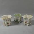 Three Enameled Eightsided Porcelain Jardinieres with Trays