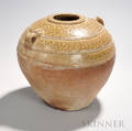 Ashglazed Storage Jar China possibly Han dynasty the bulbous form widening at the shoulders with two incised strap handles the up