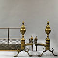Pair of Brass and Iron Acorntop Andirons and a Fireplace Fender