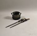 Two Steel Brass and Wood Sharpening Steels and a Bronze Pot