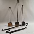 Two Wrought Iron Adjustable Trammels and Three Peels with Rams Head Finials 